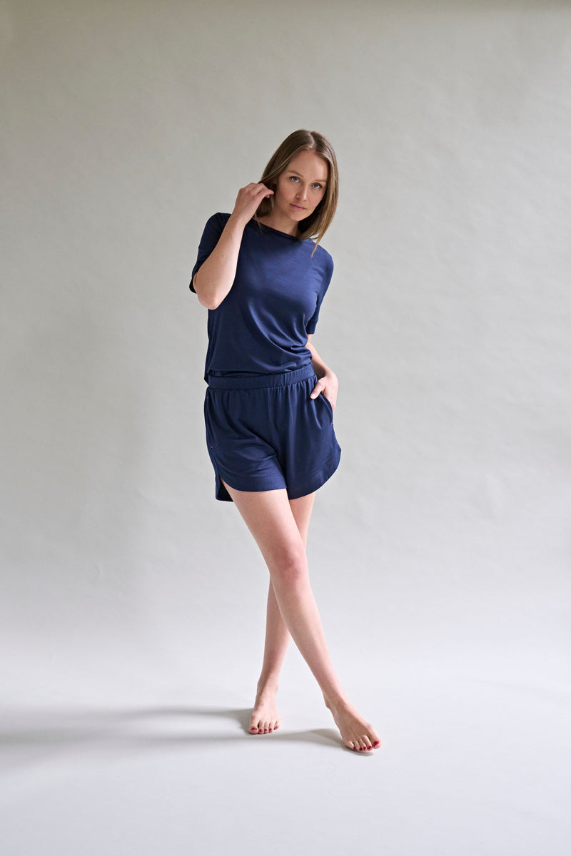 Model Stands Wearing Navy Blue Womens Merino Wool T short and Shorts